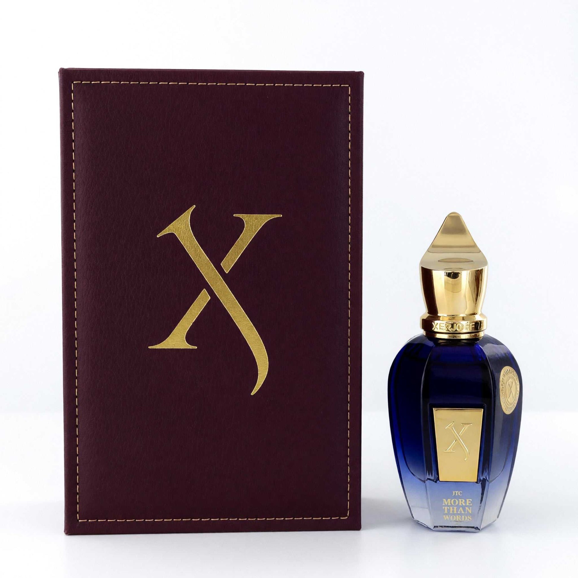Unisex EDP spray bottle with blue glass and gold cap, shown with burgundy logo box