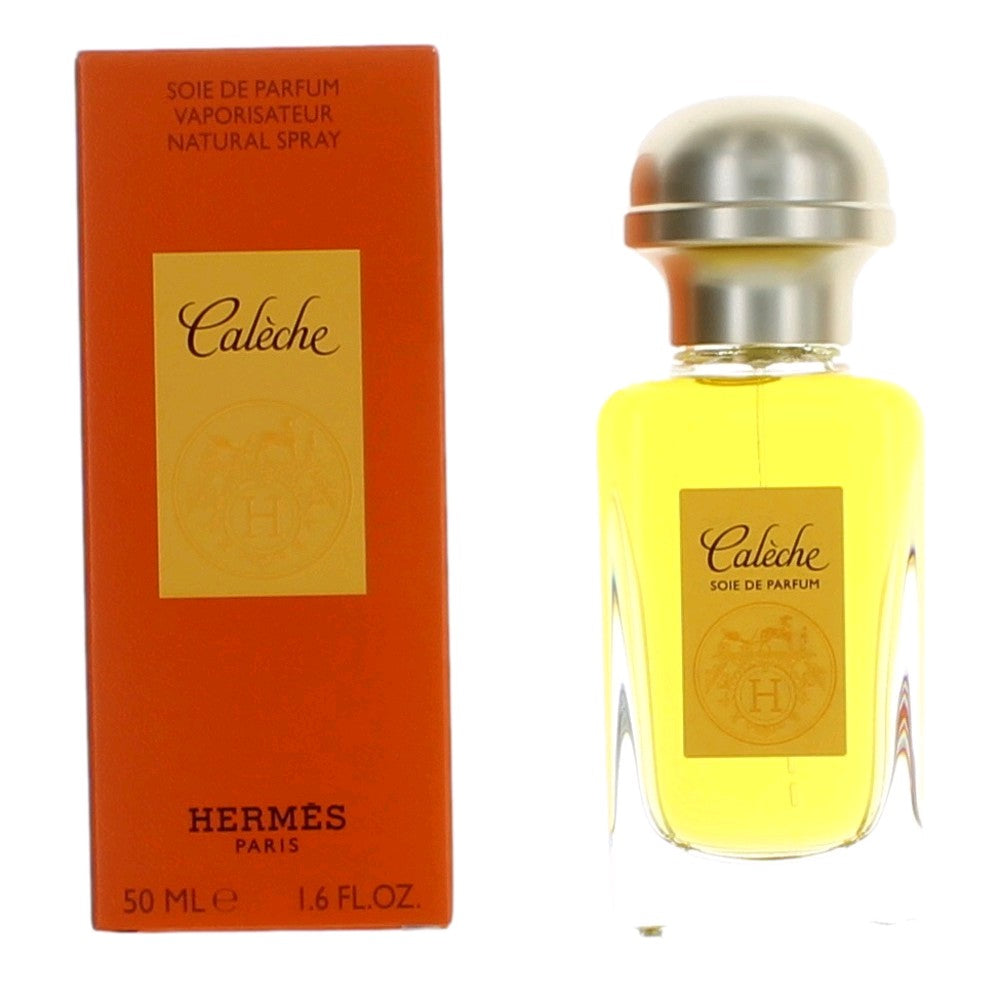 Caleche by Hermes perfume spray bottle with gold cap and matching orange box.