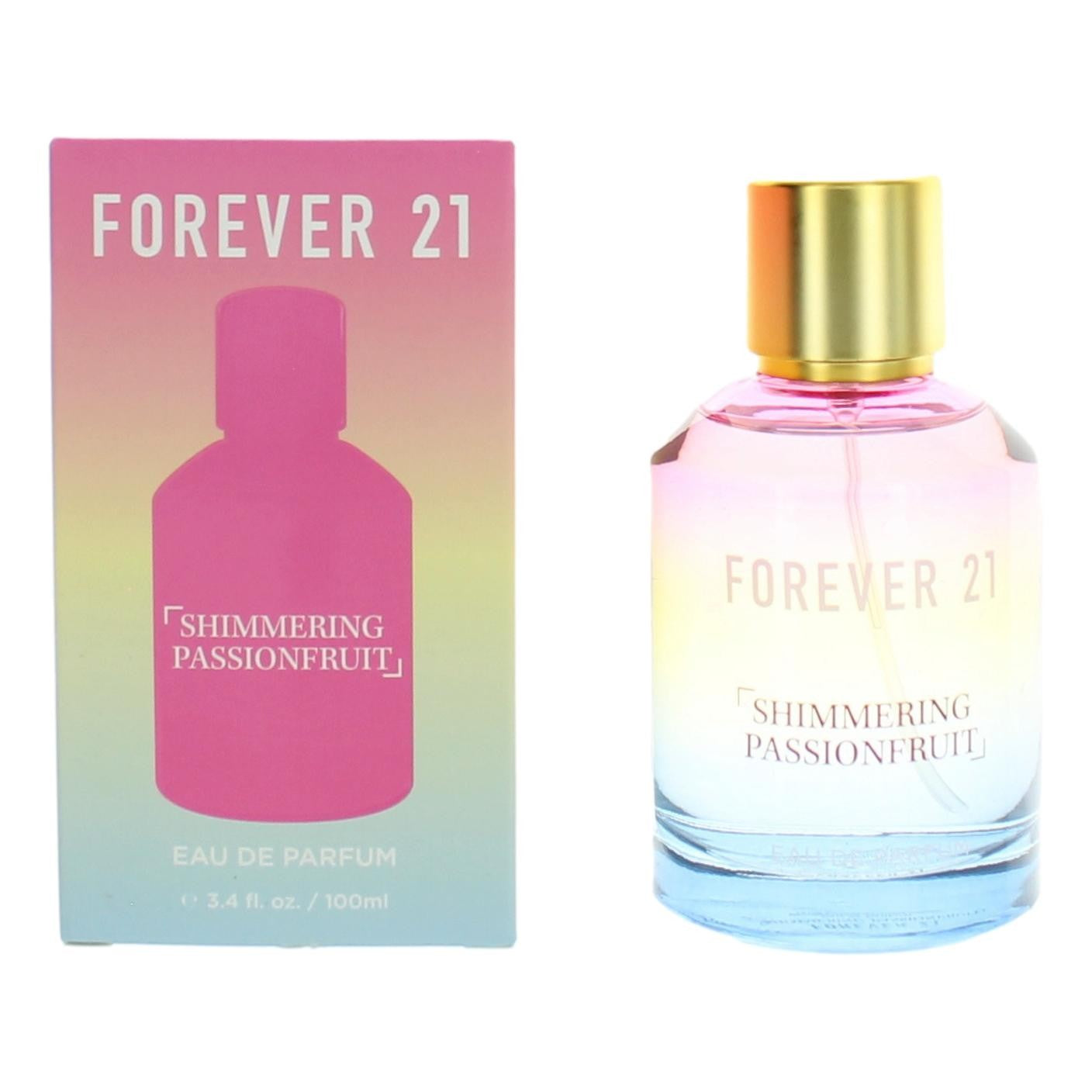 Women’s perfume EDP spray bottle with gold cap and pink liquid, with box
