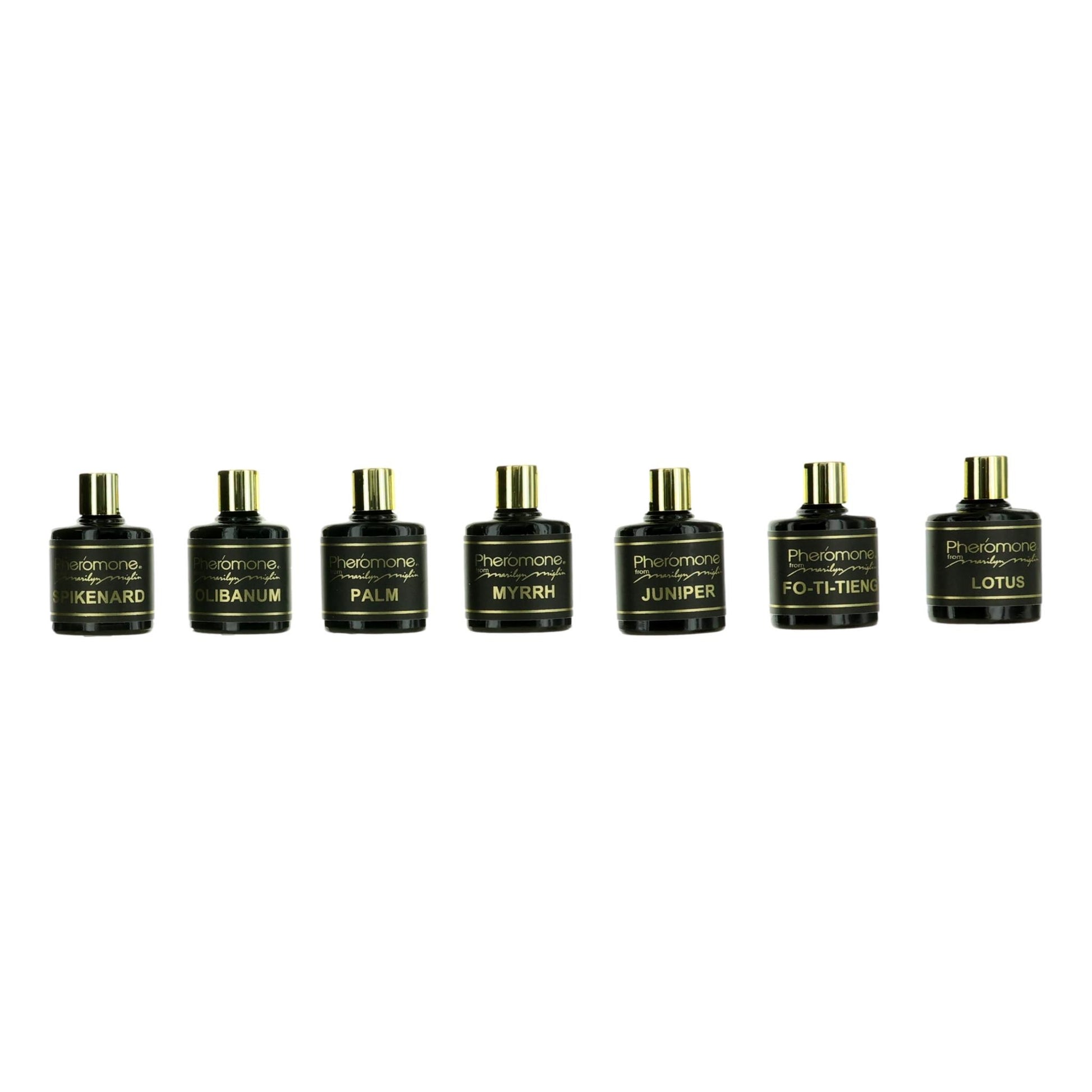 7-piece aromatherapy set with seven dark bottles and silver pump caps, labeled assorted scents.