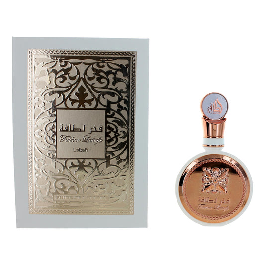 Rose-gold perfume bottle with ornate cap and matching decorative gift box