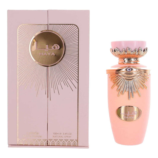 Women’s EDP spray perfume bottle in pink with ornate metallic cap, shown with box
