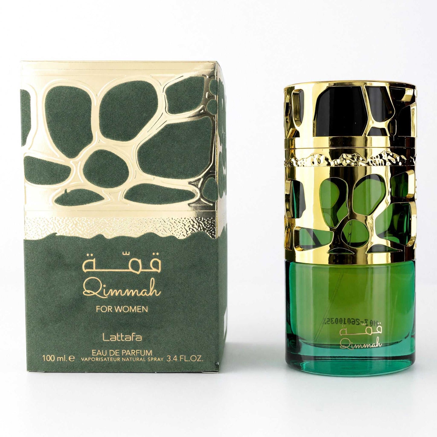 Women's perfume EDP spray bottle with green glass and gold cap, boxed set.