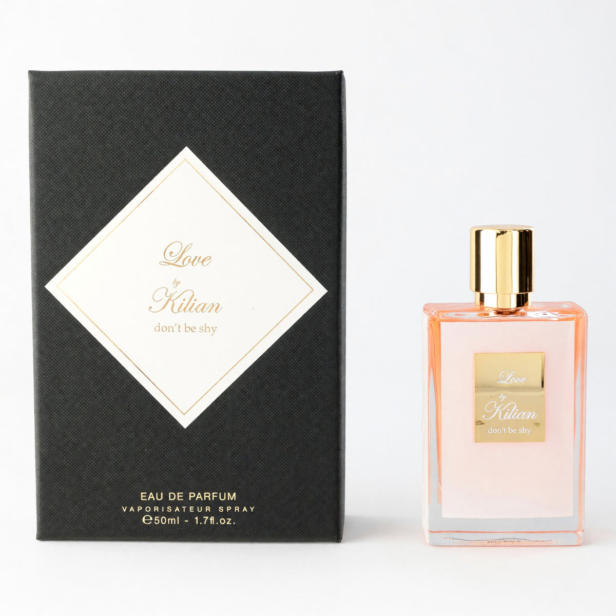 Kilian eau de parfum spray with clear pink bottle, gold cap, and black gift box