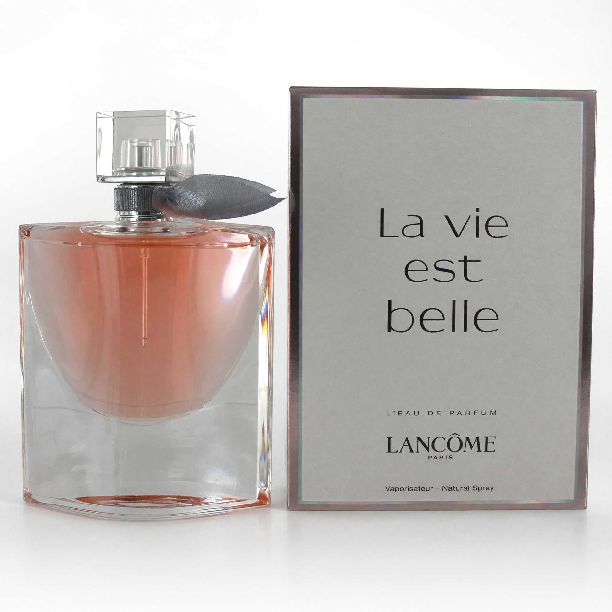 Women's Eau de Parfum spray in clear glass bottle with pink liquid and silver cap
