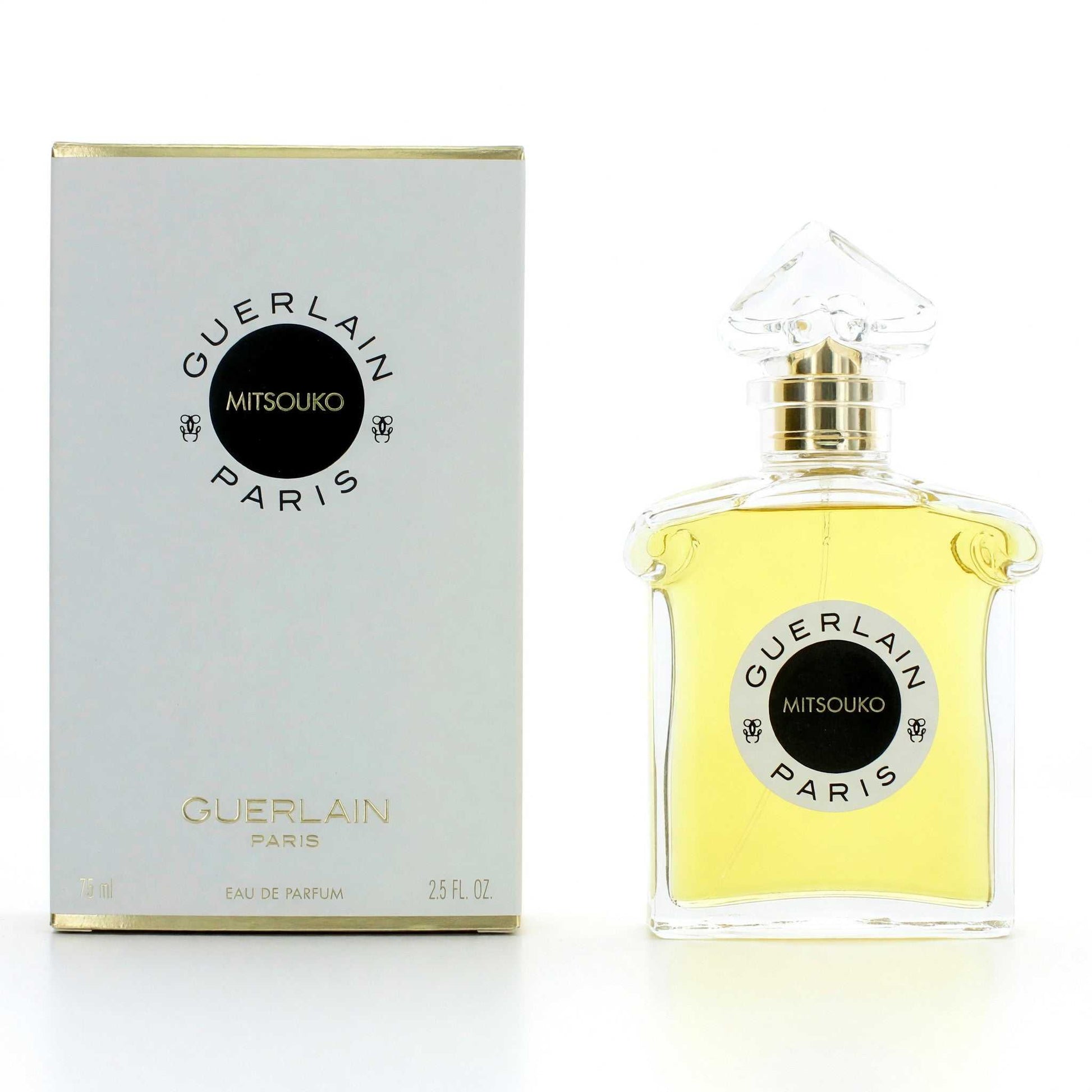 Women’s perfume EDP spray bottle with gold cap, yellow liquid, and matching box.
