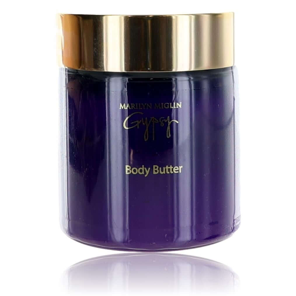 Marilyn Miglin Gypsy body butter jar with gold lid, dark purple cream texture.