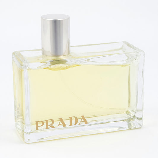 Clear glass EDP spray bottle with silver cap and PRADA logo