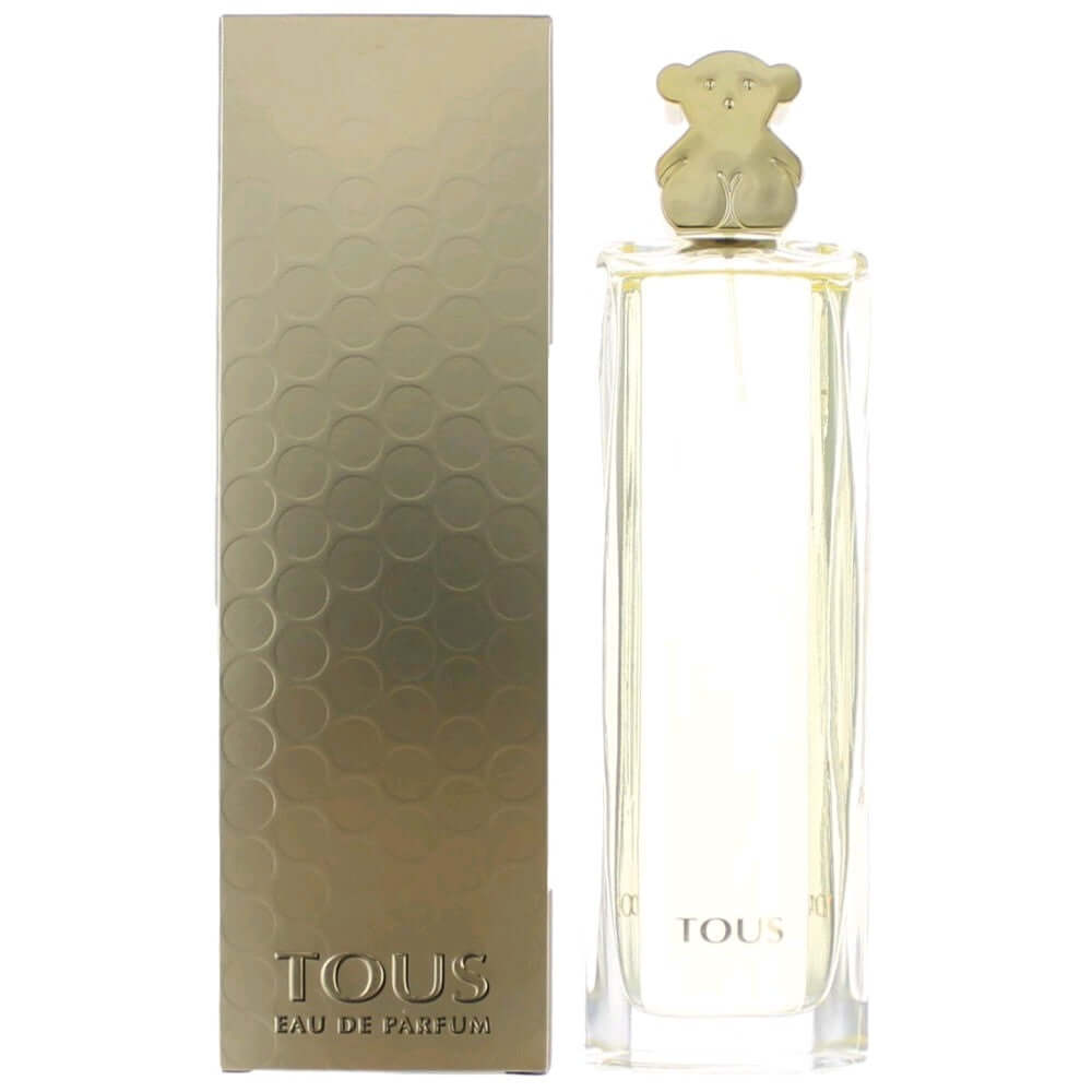 Gold-toned perfume bottle with bear cap and matching Tous box