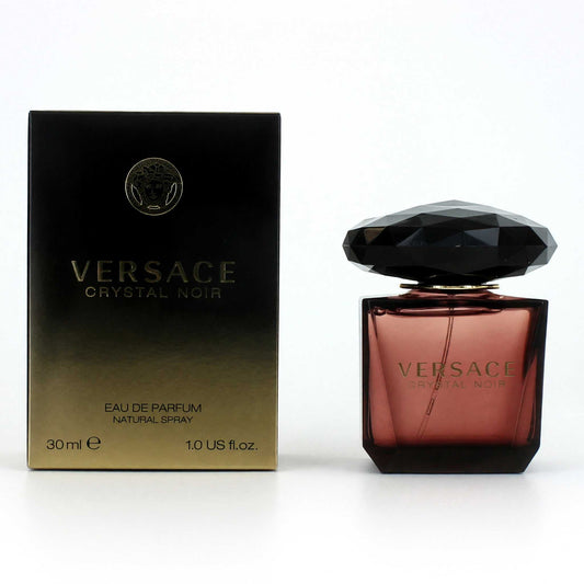 Women's eau de parfum spray with faceted black cap; box in black and gold