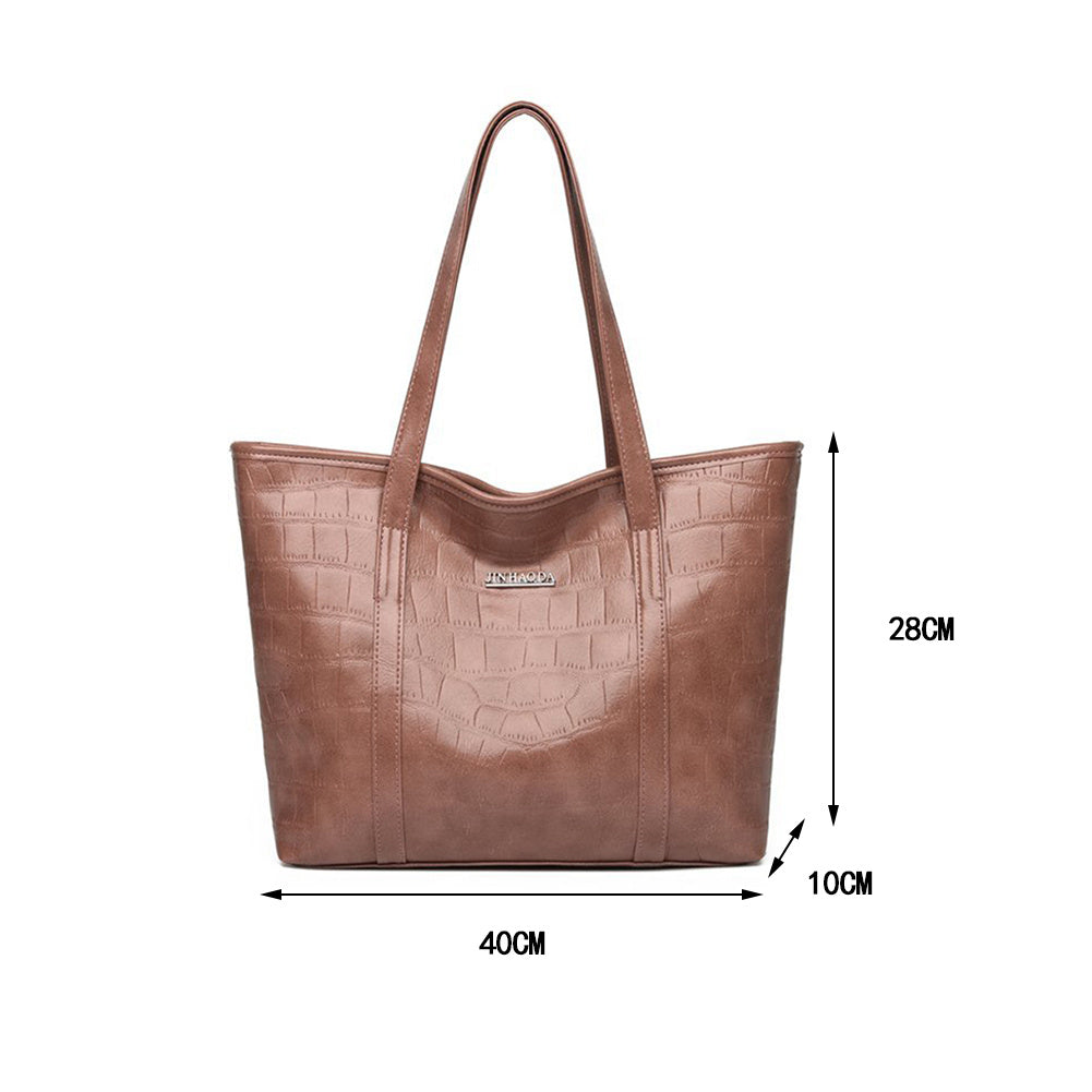 Brown leather tote bag with crocodile-texture pattern and top handles