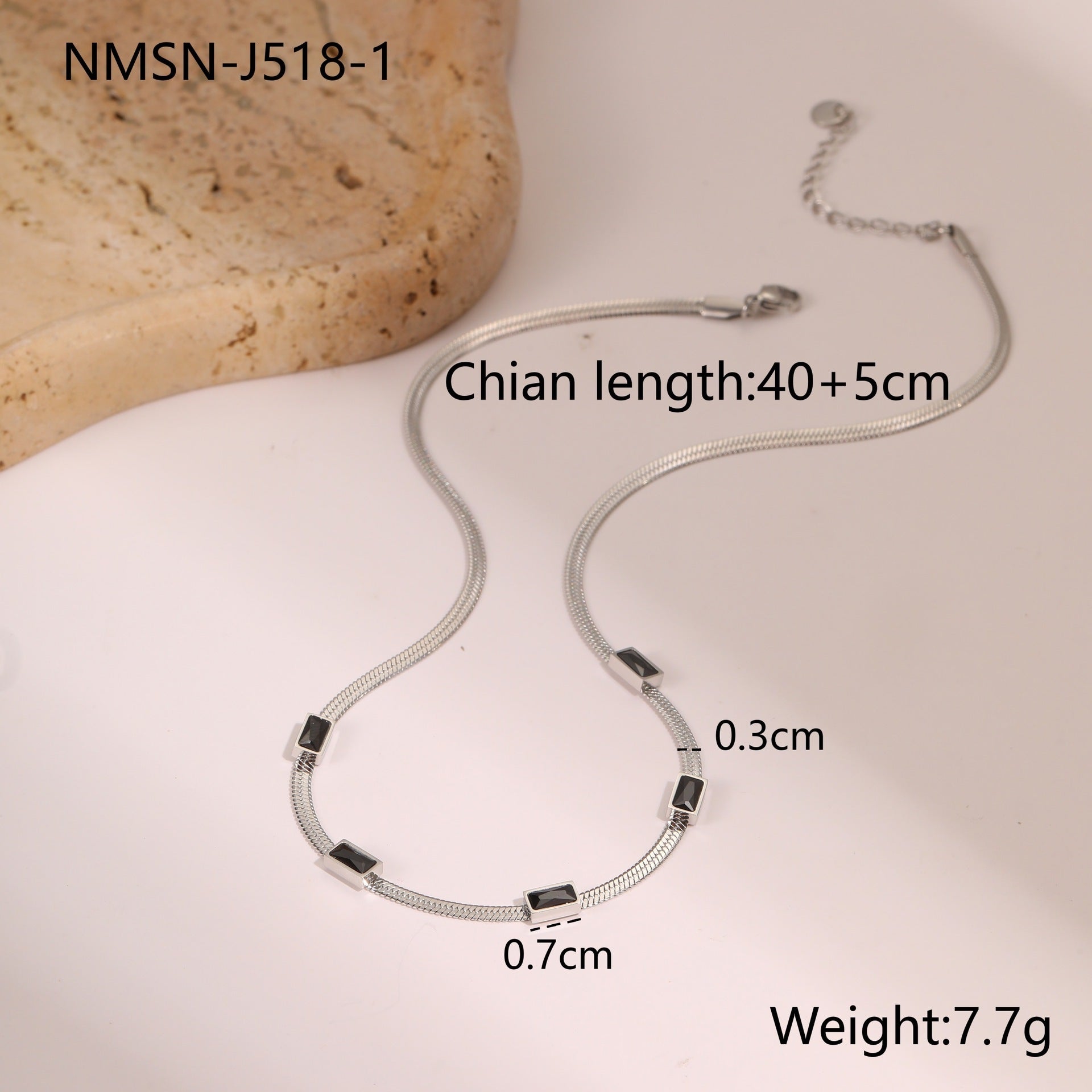 Silver snake chain necklace with square zircon links and black accents
