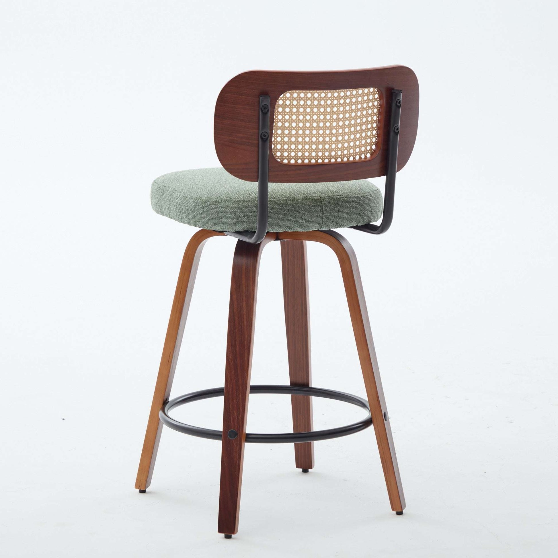 Swivel counter stool with light green seat, cane rattan back, black swivel frame and base