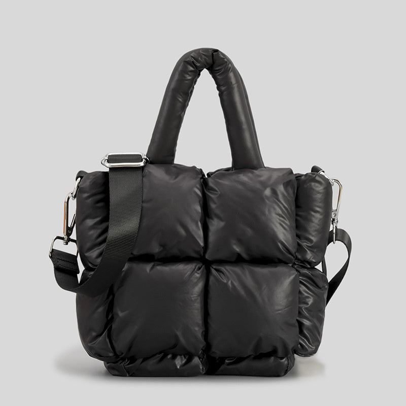 Puffer one-shoulder handbag in black with ruched quilted panels and top carrying handle