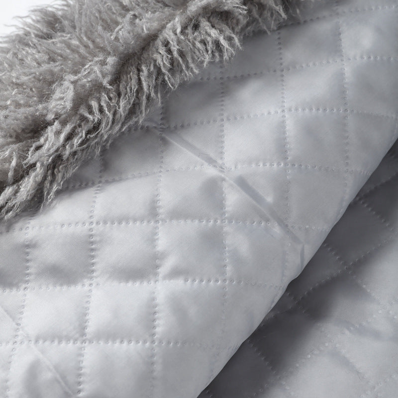 Women’s mid-length coat lining, light quilted fabric with stitched diamond pattern.