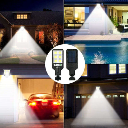 Black solar LED wall light emitting a wide bright beam from the lamp head