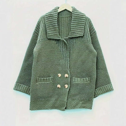 Green knitted cardigan on a white background