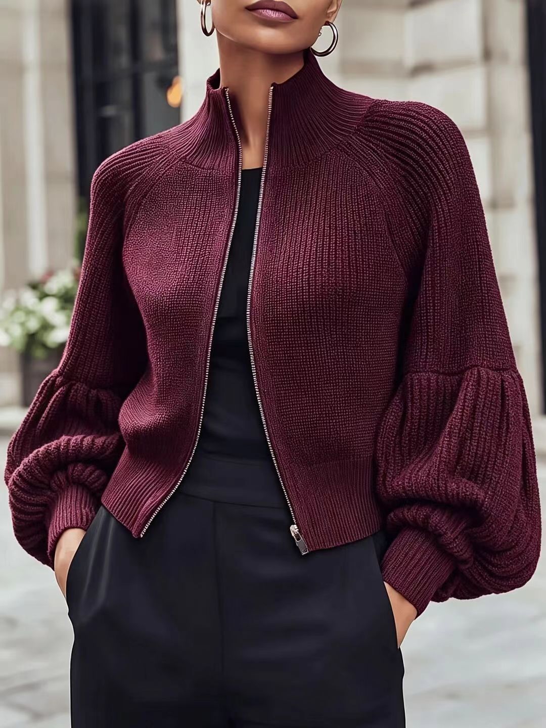Deep burgundy textured knit zip-front sweater with lantern sleeves and ribbed turtleneck collar