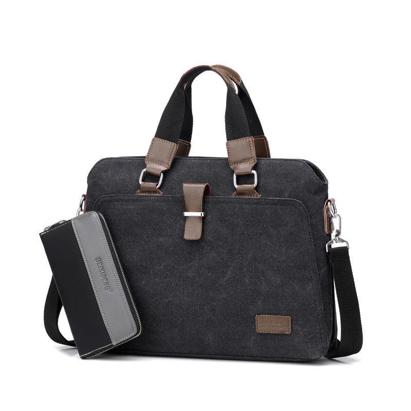 Canvas briefcase in black with left zip pocket wallet, dual handles, and front logo patch