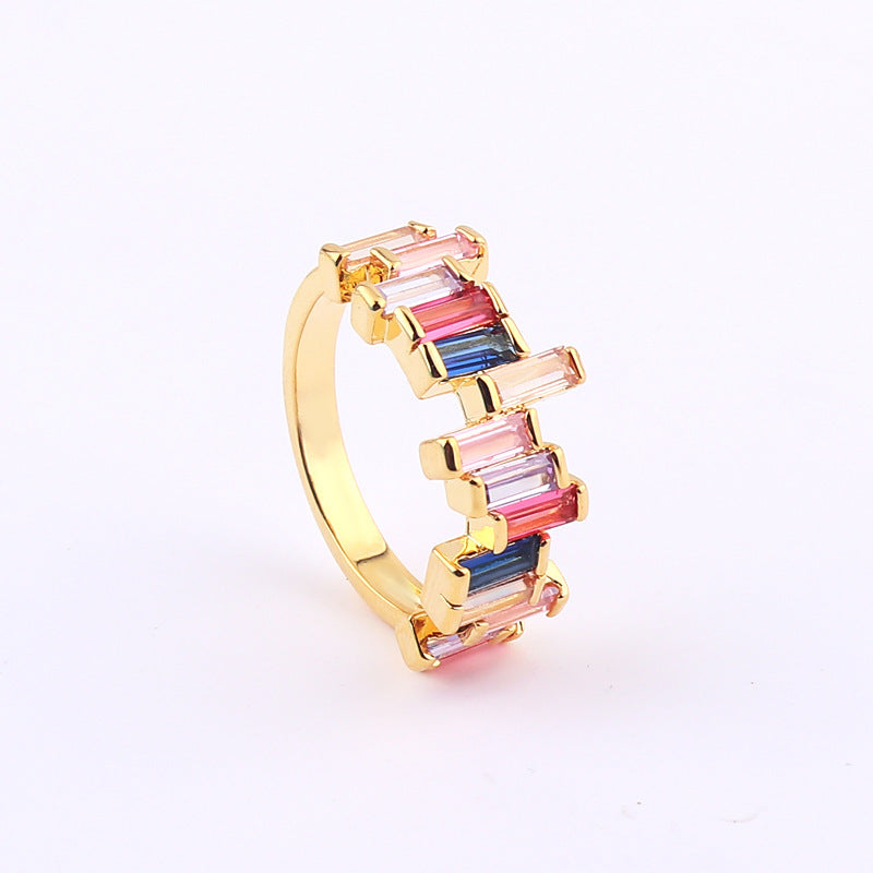 Gold-tone ring with multicolor baguette stones in pink, blue, and rainbow hues