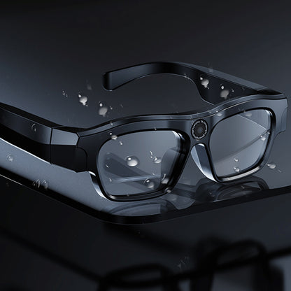 Black smart glasses with water droplets on a dark background