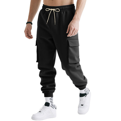 Men's loose cargo jogger pants with drawstring waist, side cargo pockets, black, ribbed cuffs.