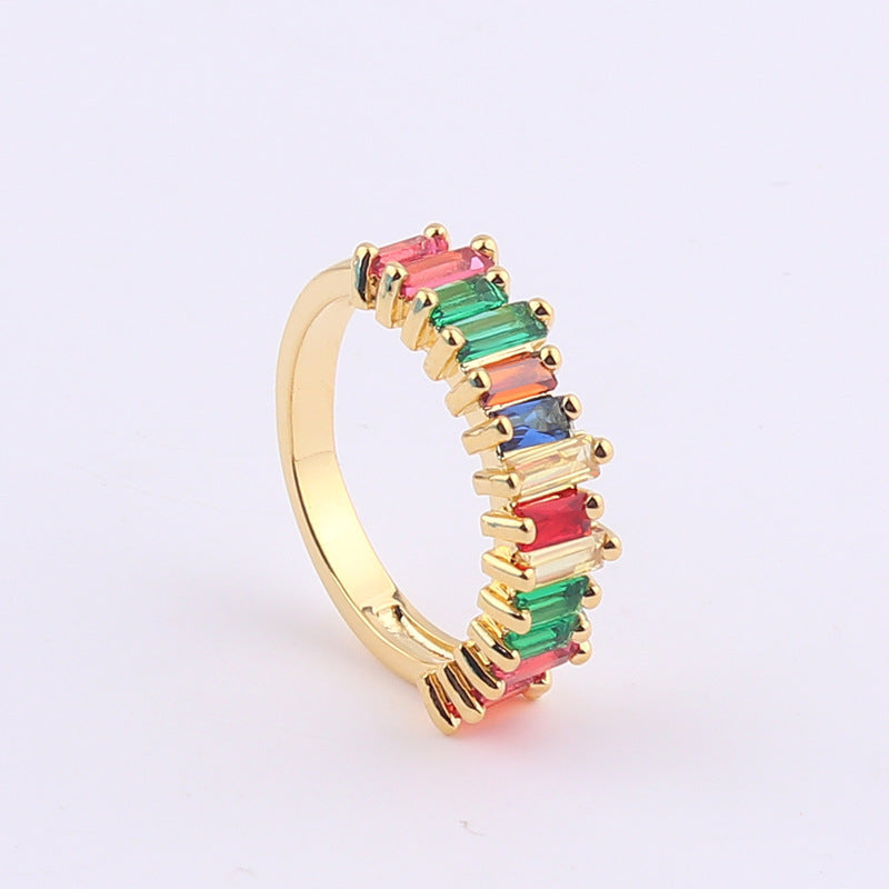Gold-tone ring with rainbow baguette stones in pink, green, and red