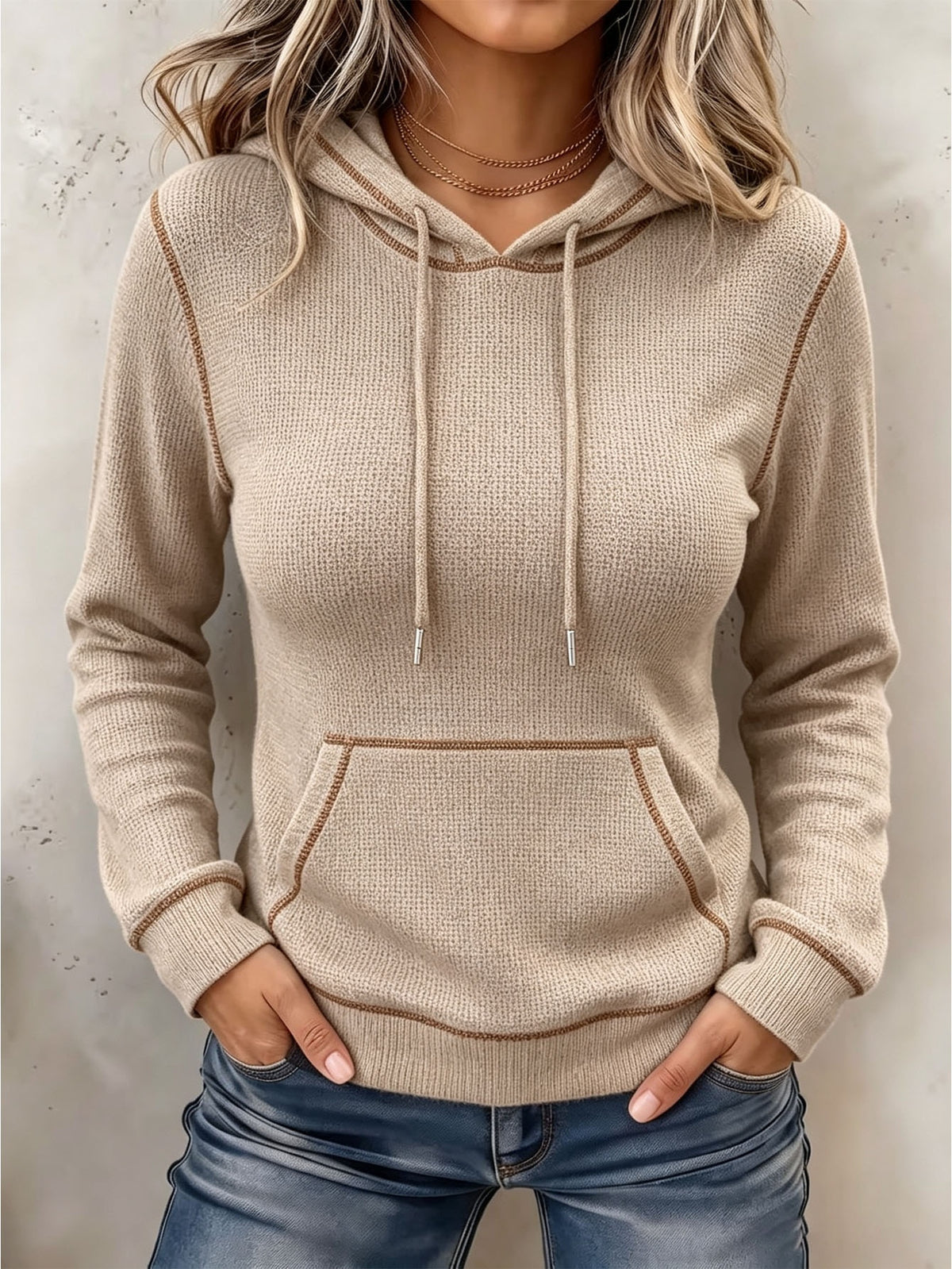 Beige long-sleeve hoodie with drawstring hood and front kangaroo pocket