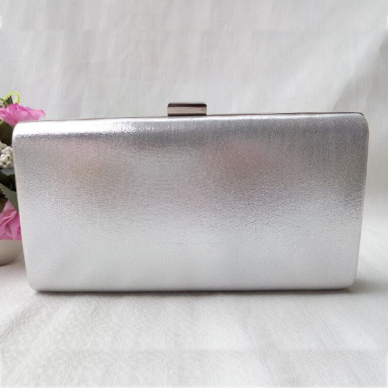 Silver glitter evening clutch bag with metal bar clasp