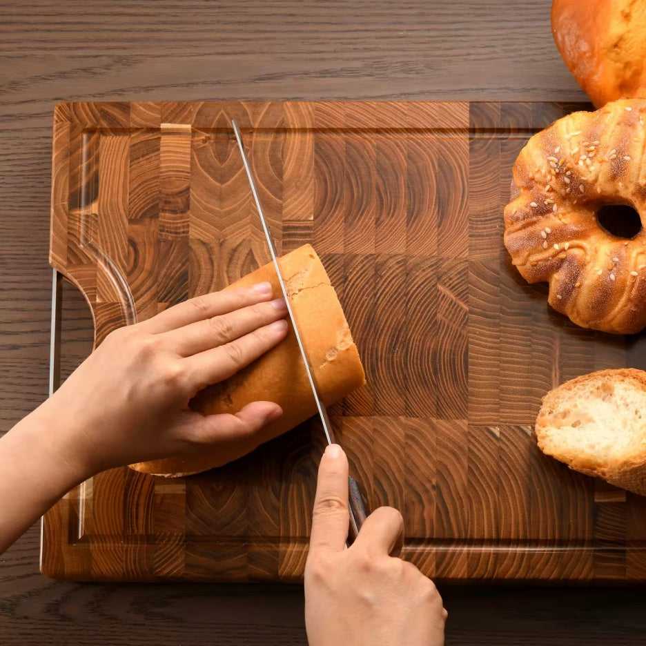 10-inch bread knife slicing a loaf on a wooden cutting board