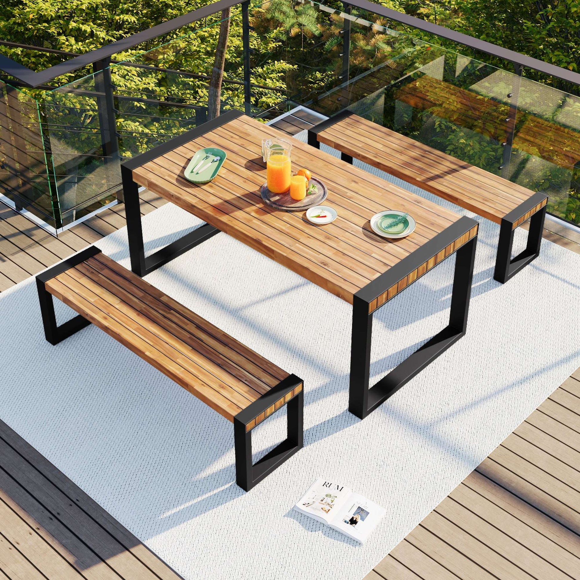 Outdoor dining table with two benches on patio, acacia wood slat tops