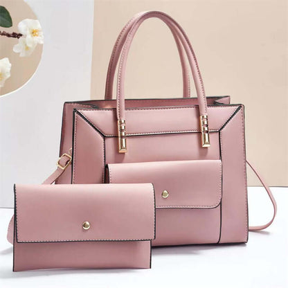 Powder pink tote bag set with top handles and matching mini crossbody bag