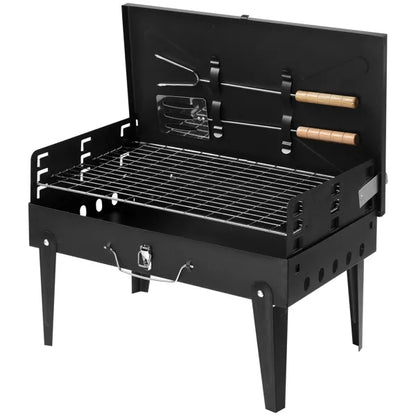 Black square charcoal grill with open lid, tool holders, and cooking grate