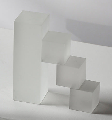 White matte crystal ladder bookends with stacked cube steps, sculptural design