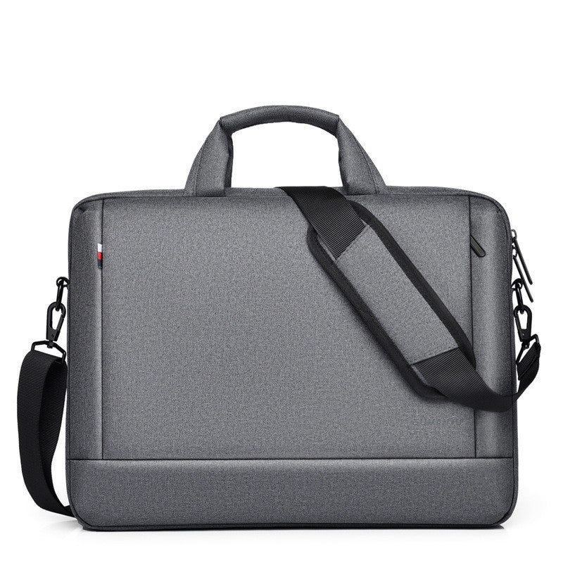 Dark grey laptop bag with top handle, diagonal shoulder strap, and zip closure