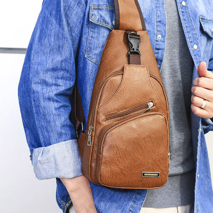 Light brown chest bag with adjustable strap and front zip pocket