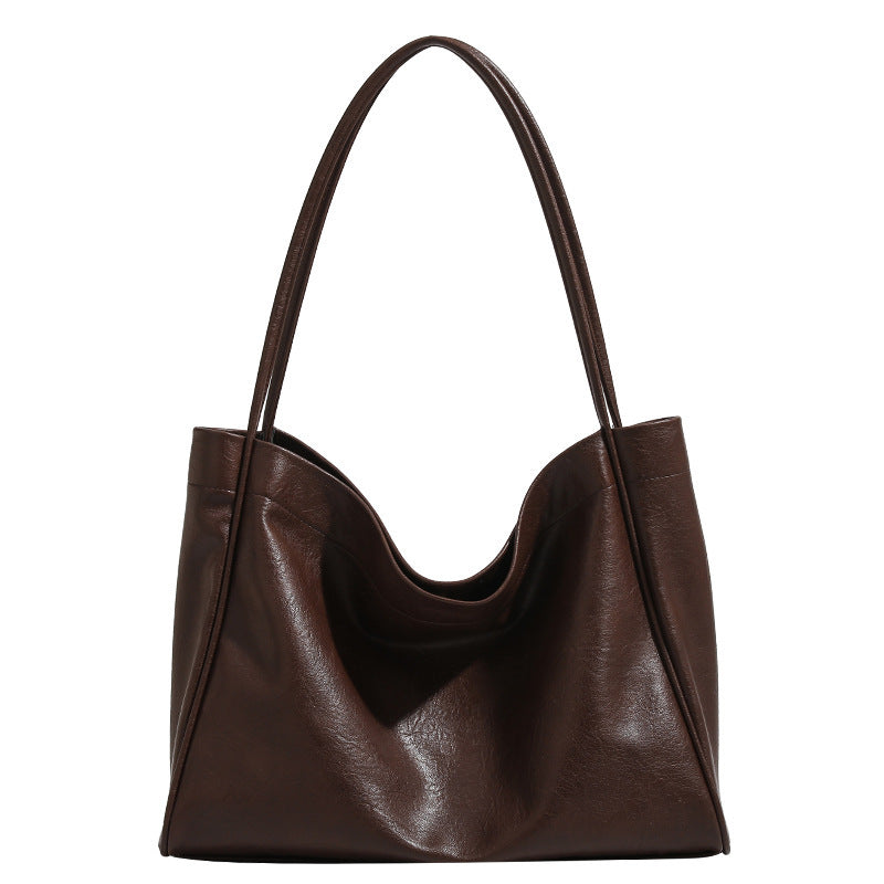 Dark brown leather tote bag with dual handles, open top and wide front