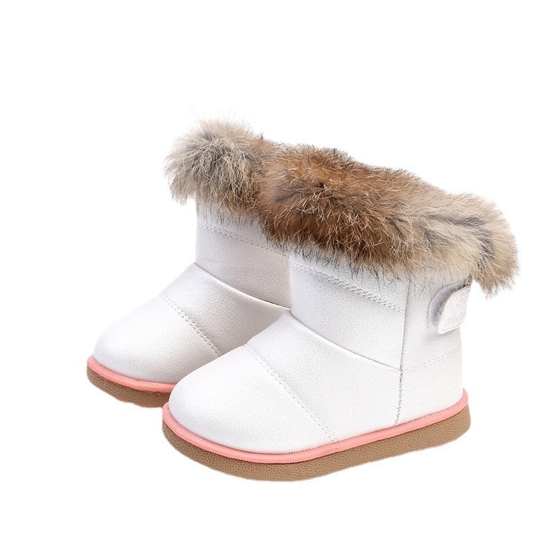 Baby girl snow boots with rabbit fur trim, white upper and brown fur cuffs with tag.