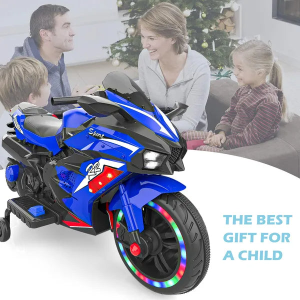 Blue toy motorcycle with colorful wheels in front of a family sitting on a couch.
