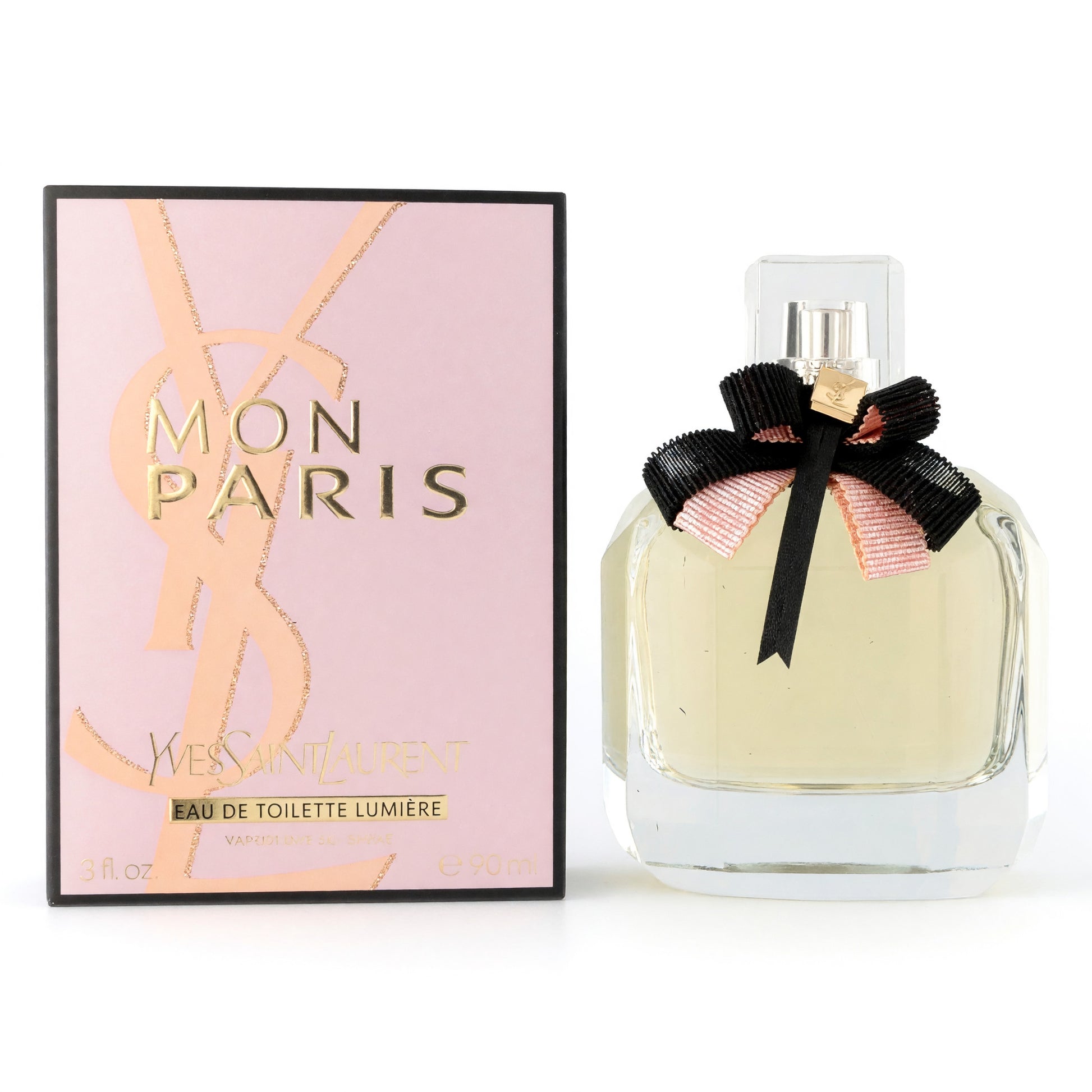 Women’s eau de toilette spray bottle with black bow and Mon Paris gift box