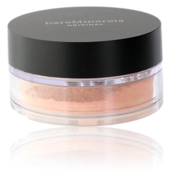 Loose powder foundation jar with black lid, beige powder visible