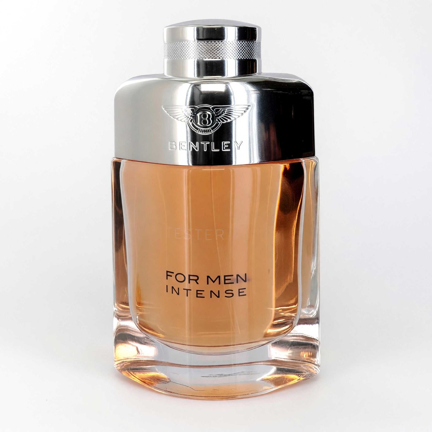 Men’s intense eau de parfum spray tester bottle with metallic cap and amber liquid