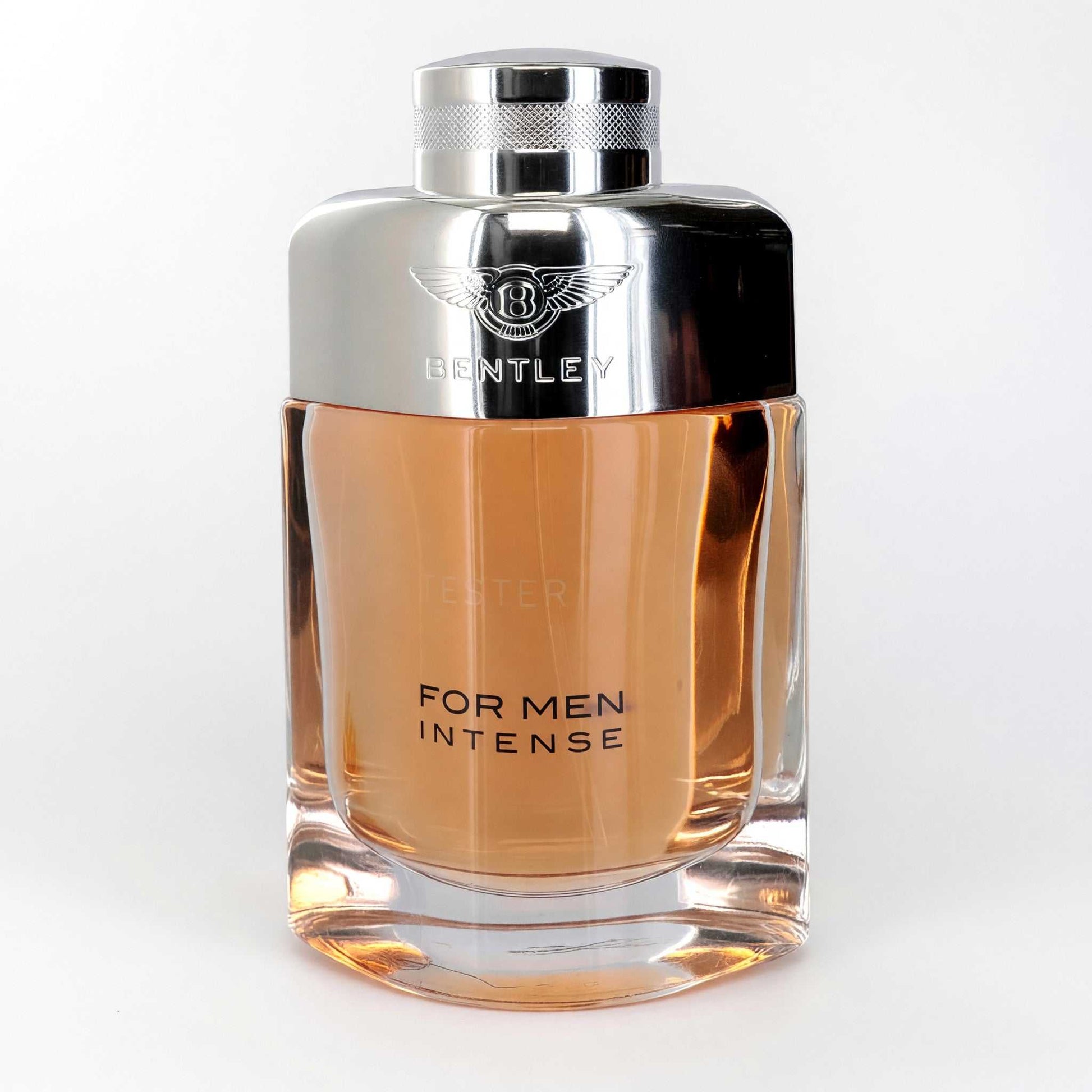 Men’s intense eau de parfum spray tester bottle with metallic cap and amber liquid