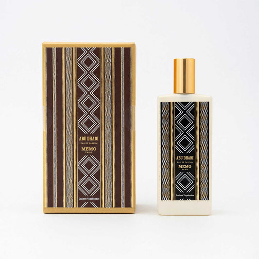 Abu Dhabi EDP spray bottle with gold cap and matching striped box, by Memo Paris