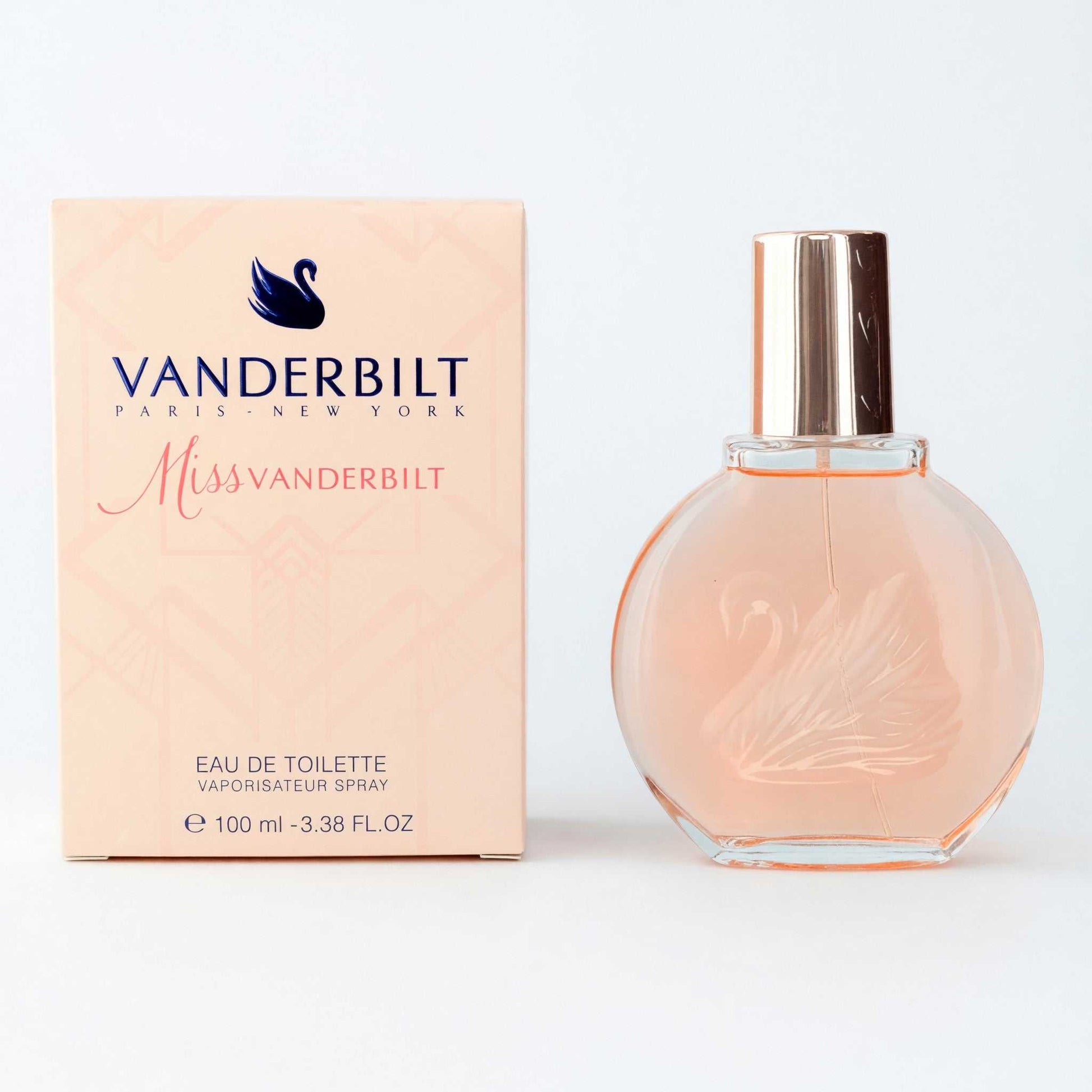 Women's eau de toilette spray bottle with pink glass and gold cap, with box