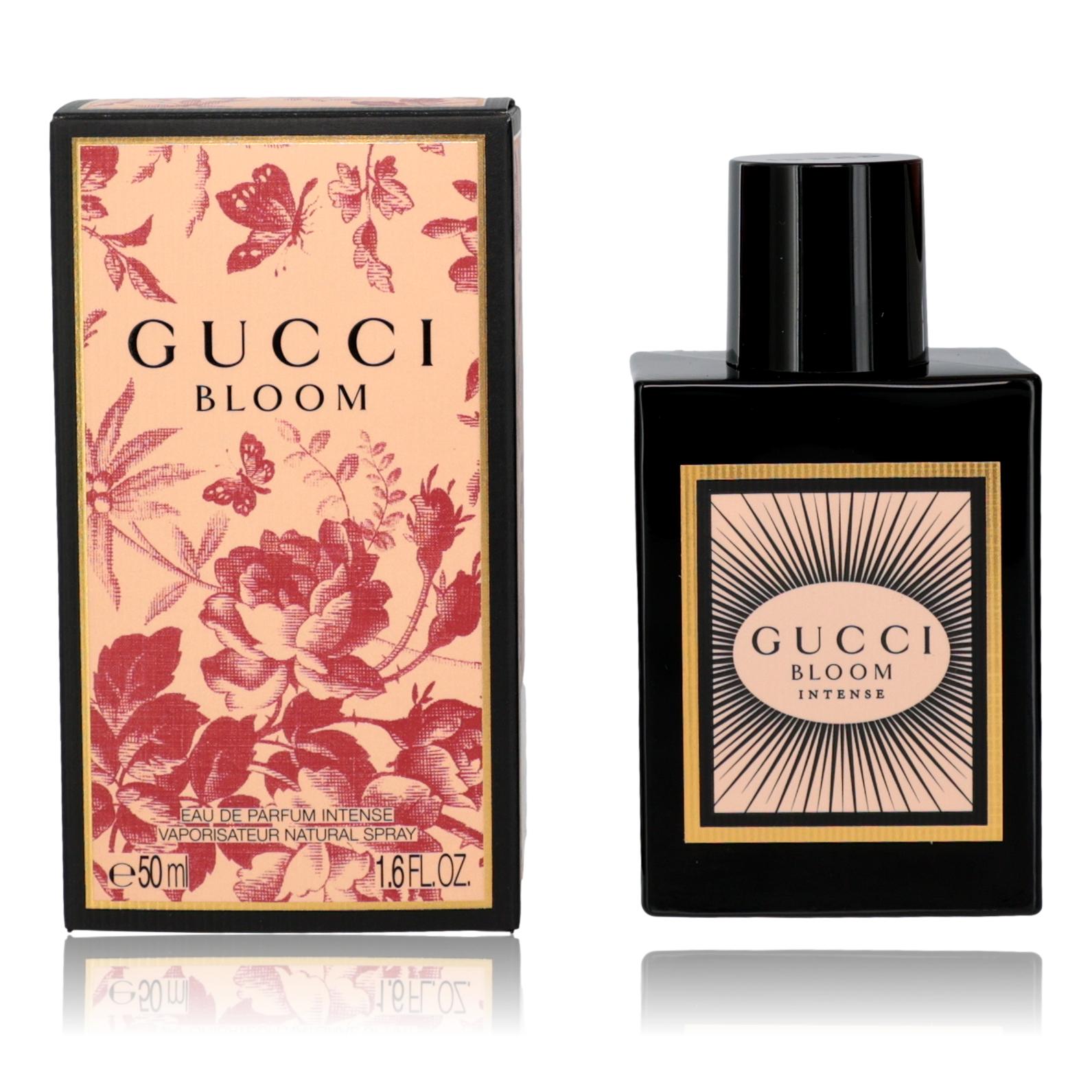 Perfume set: beige floral box and black Gucci Bloom Intense EDP spray bottle.