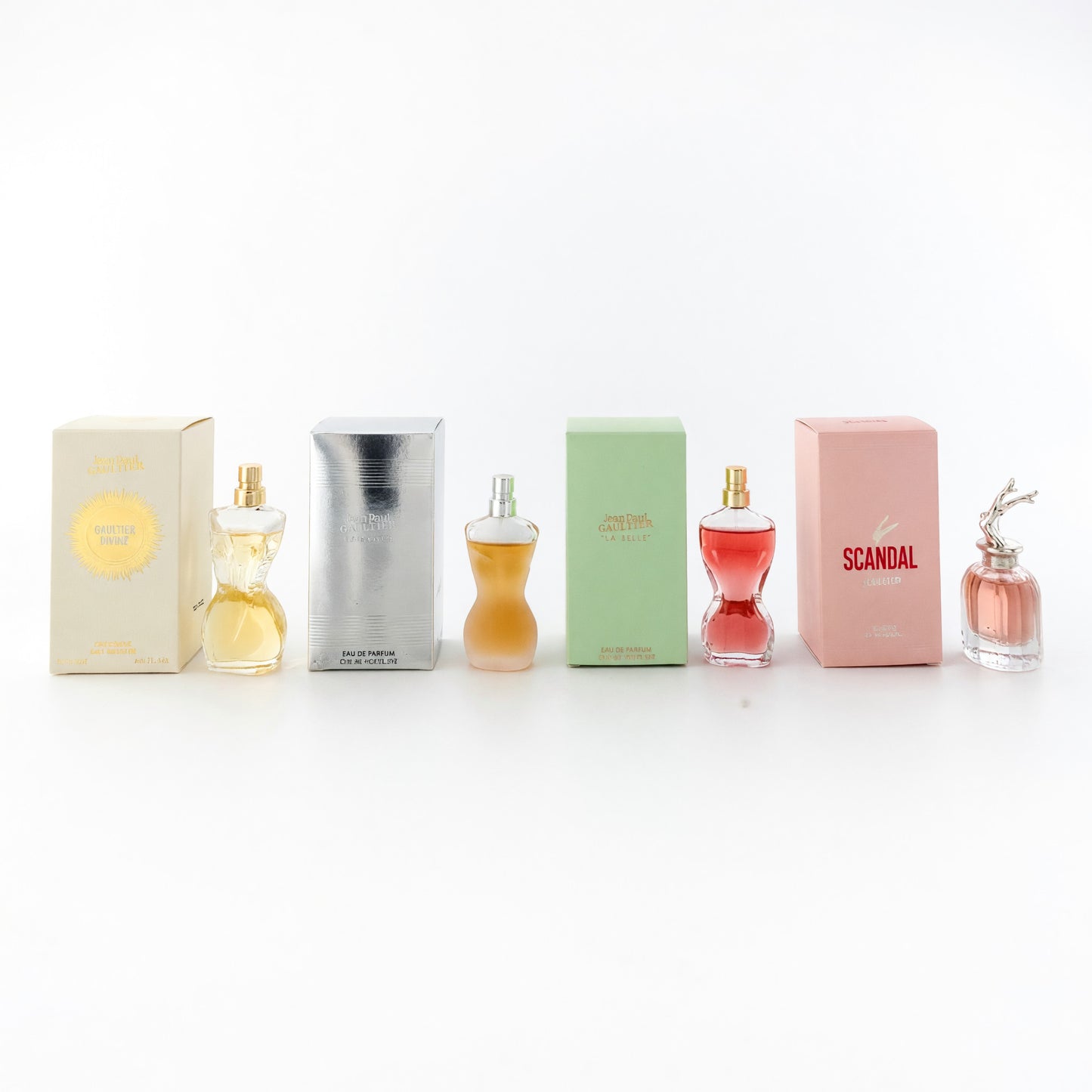 Jean Paul Gaultier mini feminine perfume set with four bottles and boxed fragrances