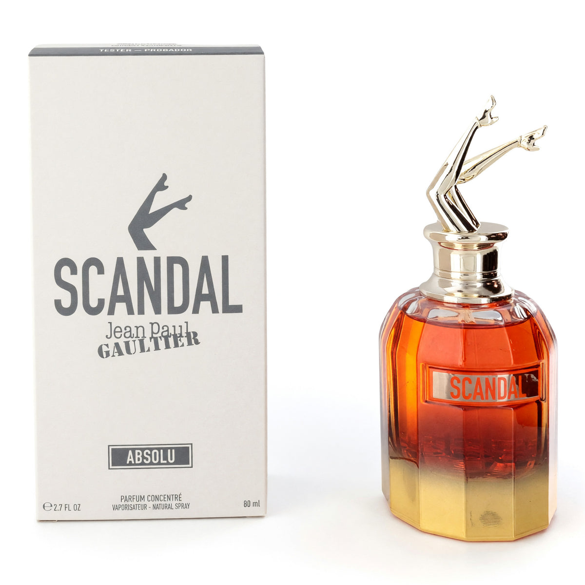 Amber glass perfume bottle with gold spray cap beside Scandal Absolu box.