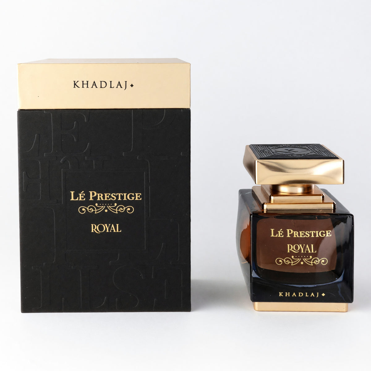 Al Khadlaj Le Prestige Royal EDP spray bottle with black gold box, amber liquid