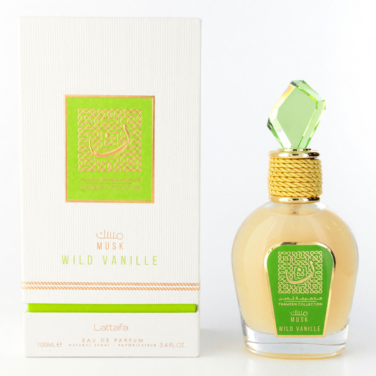 Eau de parfum spray with clear glass bottle, faceted green cap, and white green box